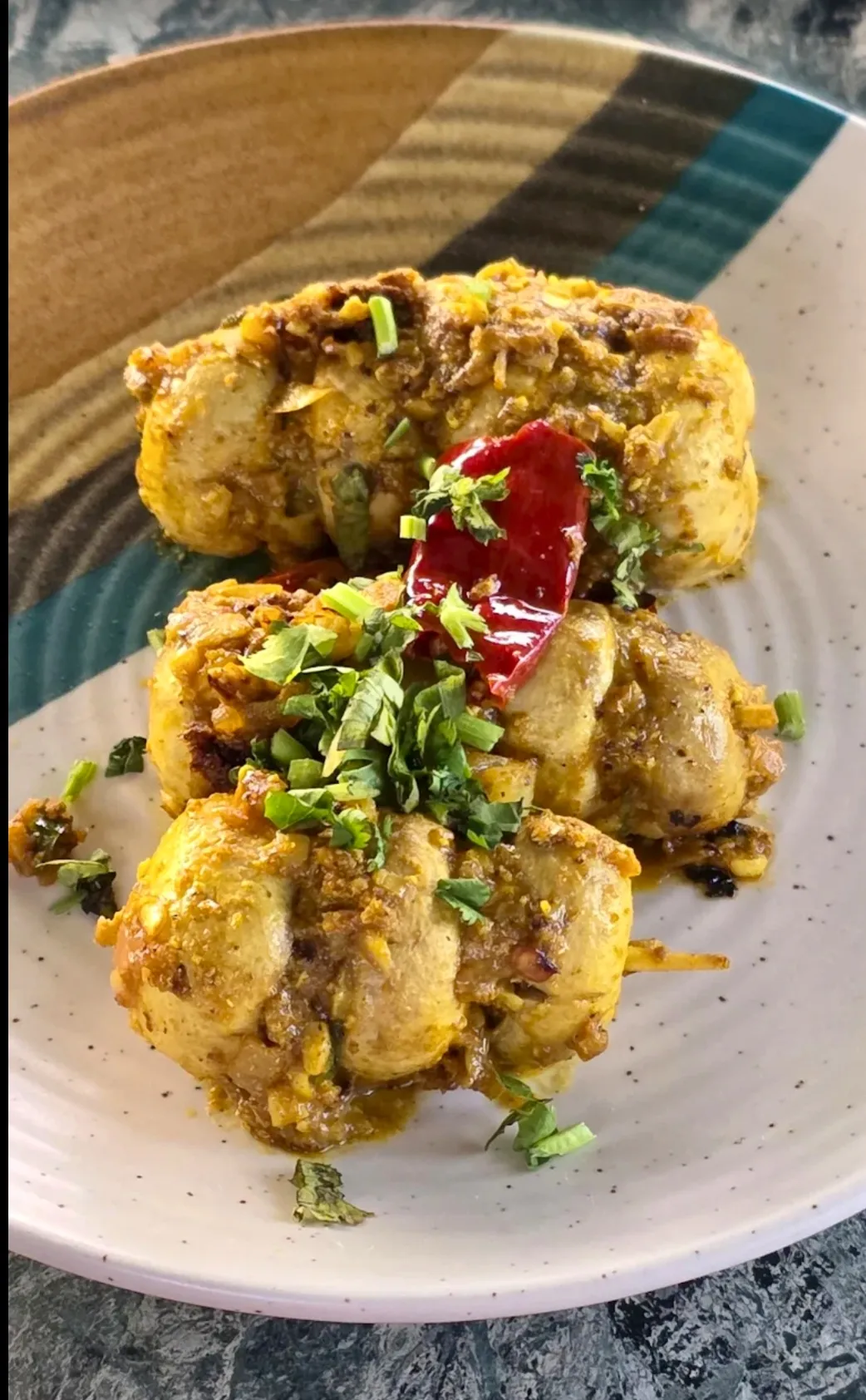 Battered cauliflower florets tossed with curry leaves and red chilli.